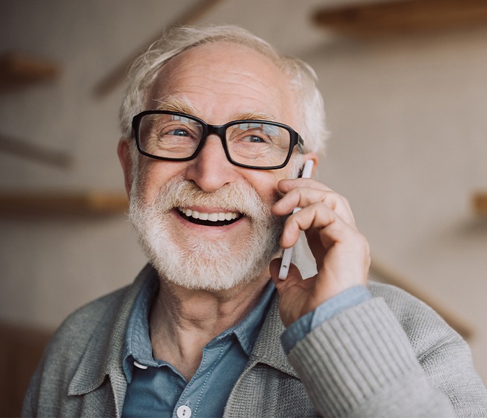 Man with all on four dental implant dentures smiling