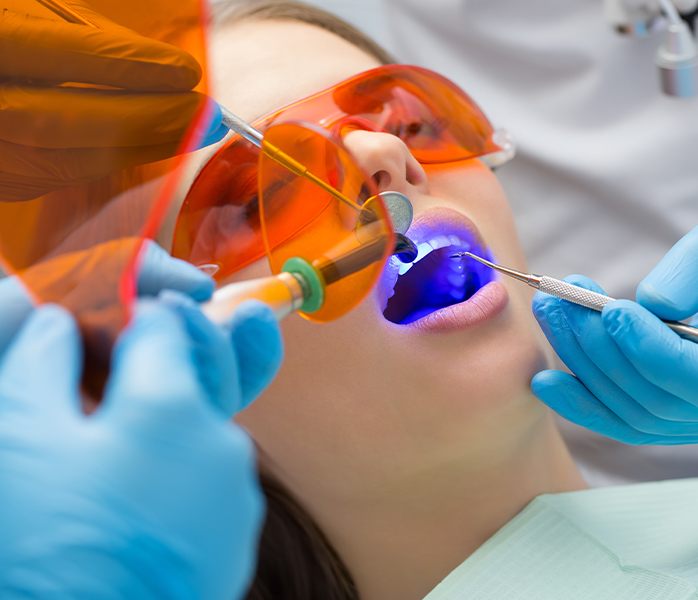 Patient receiving cosmetic dental bonding