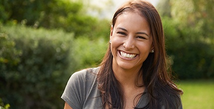 Happy, smiling woman enjoying time outdoors