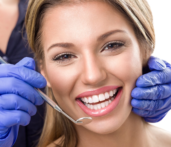 Woman smiling during preventive dentistry visit