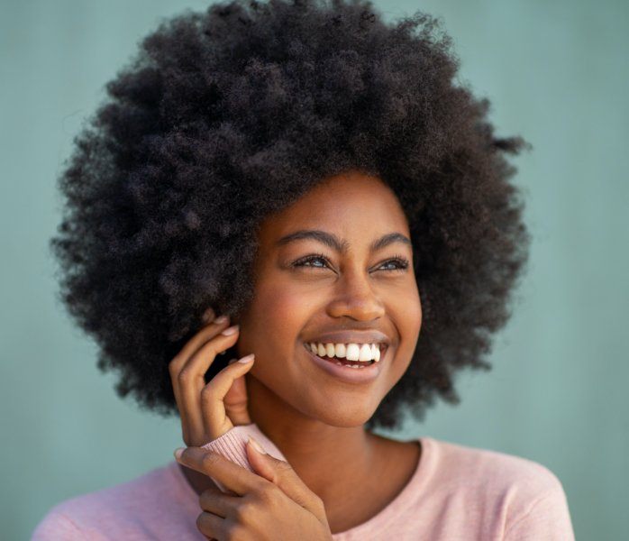 Woman with flawless smile after dental bonding