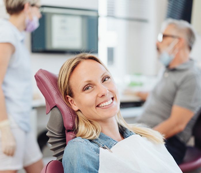 Woman smiling at a dentist in Millersville