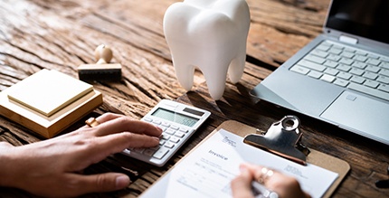 A patient assessing their dental insurance benefits