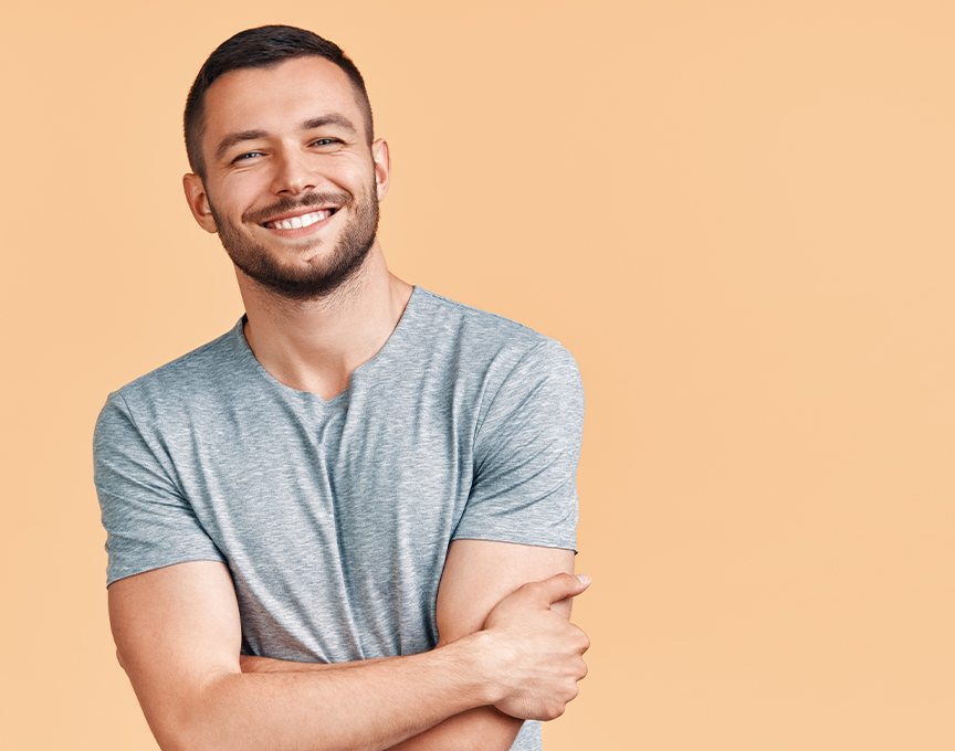 Man with healthy smile after tooth extraction