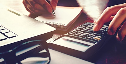 Woman using a calculator