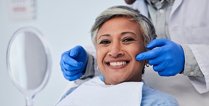 a patient smiling during a dental checkup