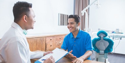 patient talking to dentist about financing options 