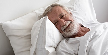 Man resting after dental implant surgery