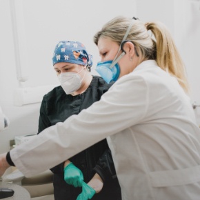 Dental team members reviewing dental patient chart