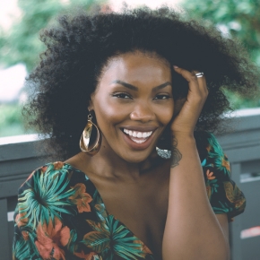 Woman in floral blouse smiling