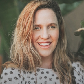 Woman in dotted blouse smiling