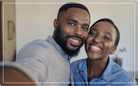 man and woman smiling together