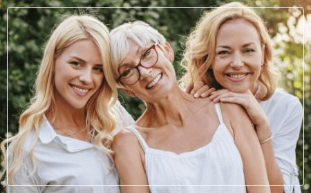 three women smiling together