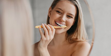 Woman brushing her teeth