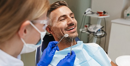 patient getting checkup to prevent dental emergencies in Millersville