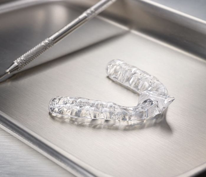 Clear nightguard for bruxism on metal tray