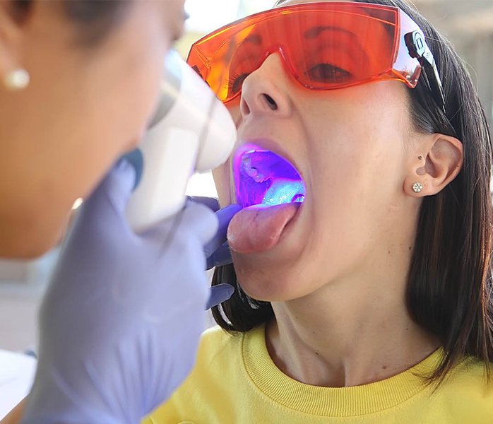 Patient receiving oral cancer screening