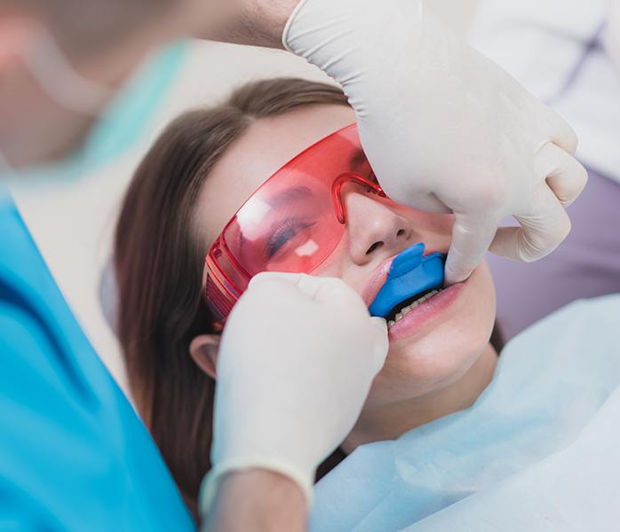 Patient receiving fluoride treatment