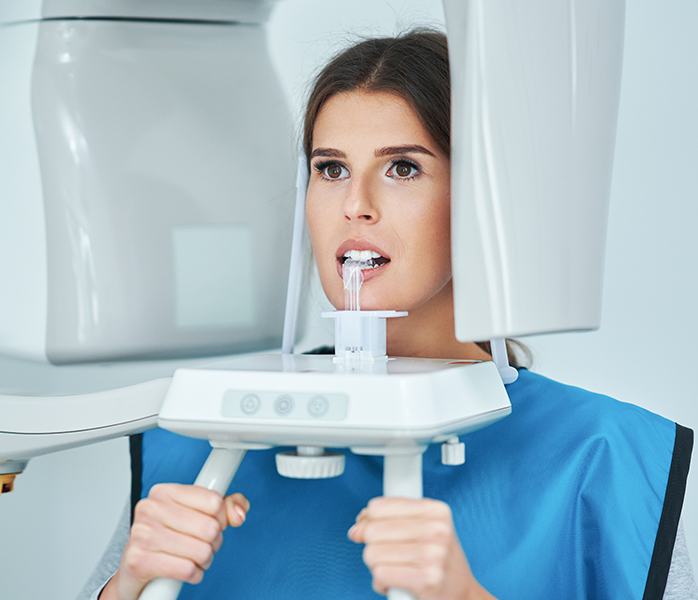 Woman receiving digital x-ray scans