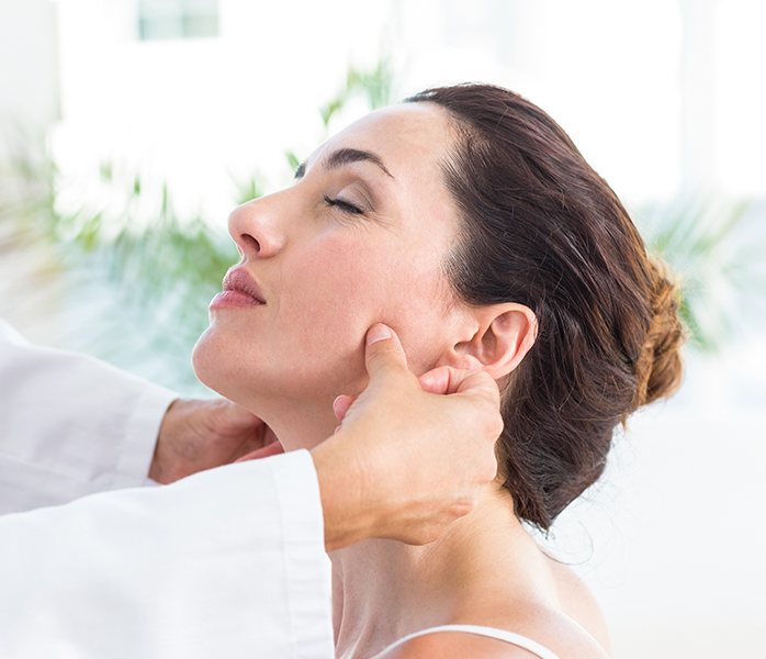 Woman receiving equilibration and occlusal adjustment