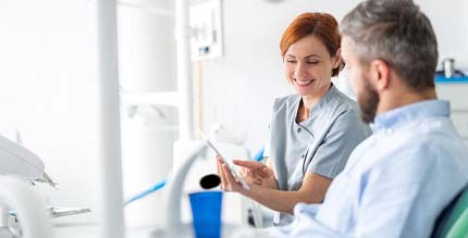 dentist discussing cosmetic options with patient in Millersville