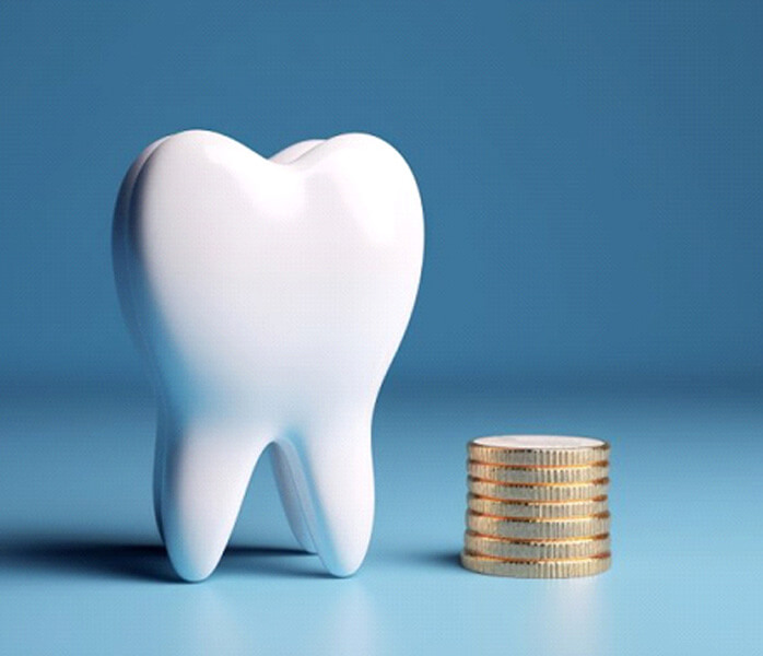 a tooth and coins representing the cost of teeth whitening