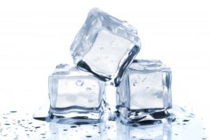 Cubes of ice stacked on one another.